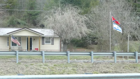 House in southwest Virginia flying Israeli, Confederate and American flags.